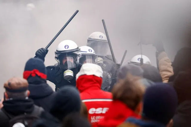 Riot police confront demonstrators at national strike in Brussels Belgium