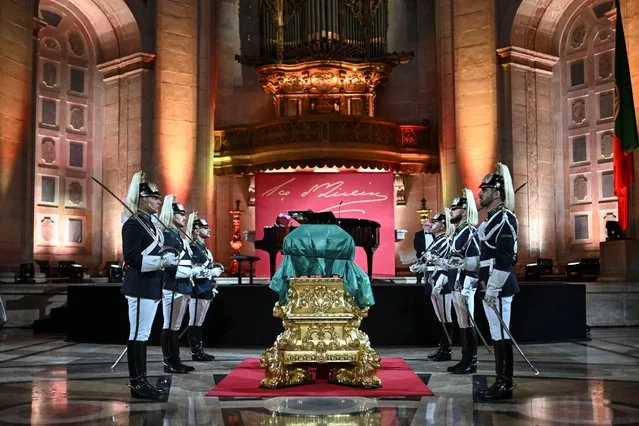 Coffin of Portuguese novelist Eca de Queiroz flanked by guards during transfer to National Pantheon Lisbon