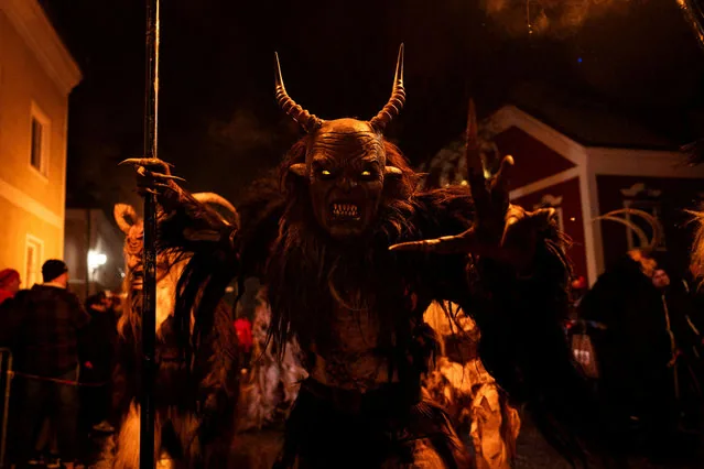 Costumed participants march in the traditional Perchten parade in Windischgarsten Austria January 2025