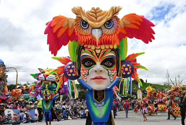 Performers with traditional floats at the UNESCO-recognised Blacks and Whites carnival in Pasto Colombia
