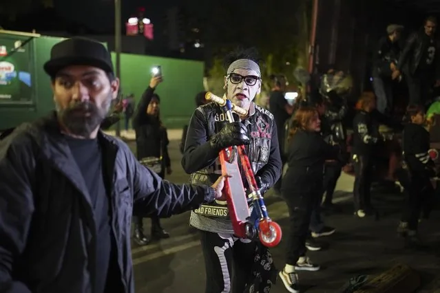 Punk Kings volunteers load truck with toys and pinatas for Three Kings Day children in Mexico City