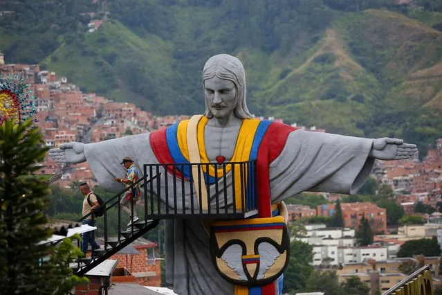 Visitors gather at Cristo Redentor Paisa the largest 3D printed monument in Latin America Medellin