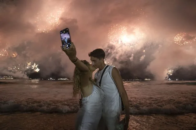 Couple kissing under New Year fireworks at Copacabana Beach Rio de Janeiro 2025