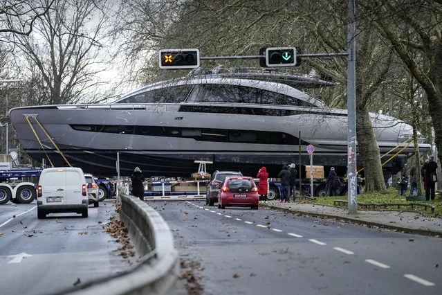 Luxury Italian yacht Pershing GTX 80 crossing street in Duesseldorf heading to boat fair