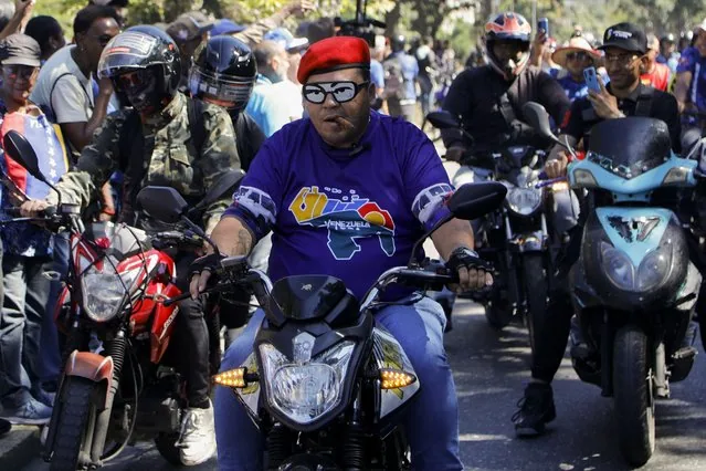 Venezuelan protesters and government supporters clash in Caracas before Maduro's third term