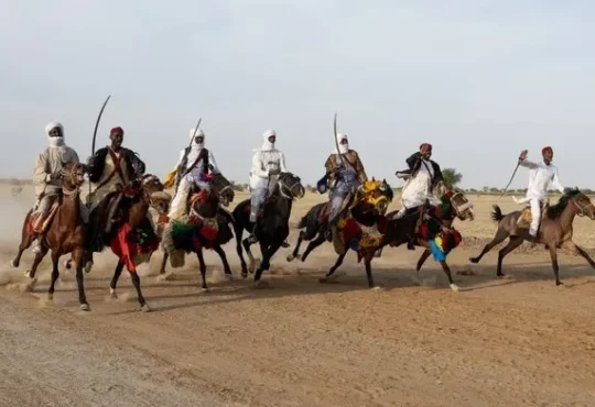 Horse riders performing fantasia at Grand Prix Apec opening at Ouka-Djermaya racecourse Chad