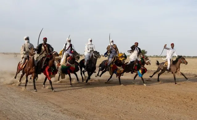 Horse riders performing fantasia at Grand Prix Apec opening at Ouka-Djermaya racecourse Chad