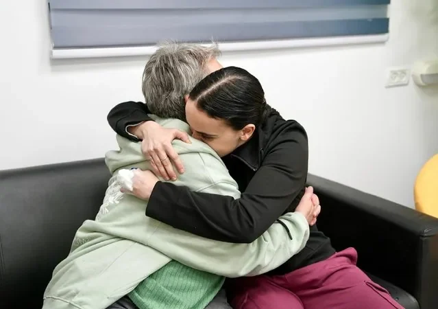 Emily Damari embraces her mother Mandy near kibbutz Reim Israel after Hamas release January 2025