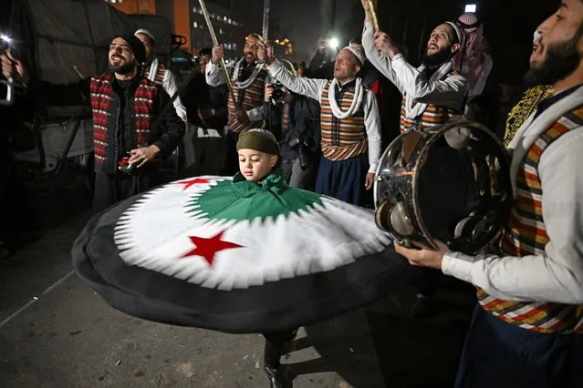 Boy dances at Umayyad Square Damascus welcoming displaced Syrians from Idlib January 2025