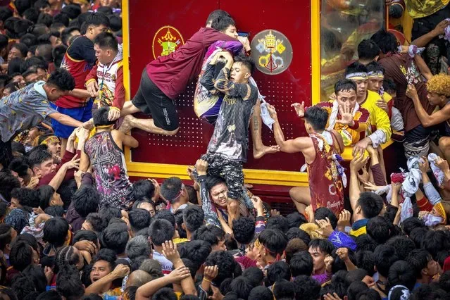 Filipino devotees reach to touch Black Nazarene during annual Manila procession January 2025