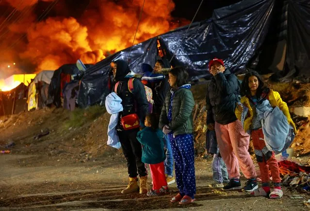 Migrants react as makeshift camp catches fire during eviction operation Chihuahua Mexico January 2025
