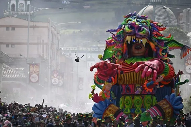 Performers on traditional floats at Blacks and Whites carnival parade in Pasto Colombia