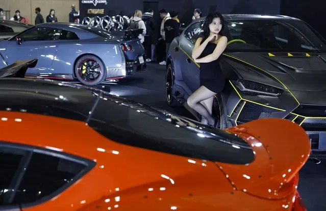 Model poses at 2025 Tokyo Auto Salon car show in Chiba near Tokyo Japan