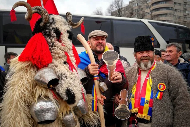 Romanian protesters hold mock stamps reading Free Elections at AUR rally Bucharest January 2025