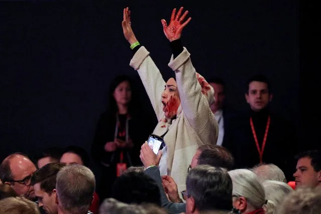 Protester shouts Free Palestine as Olaf Scholz campaigns in Bielefeld Germany January 2025