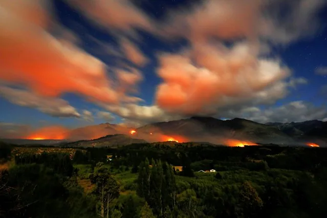 Wildfire flames and smoke rise over Epuyen in Chubut Patagonia Argentina January 2025