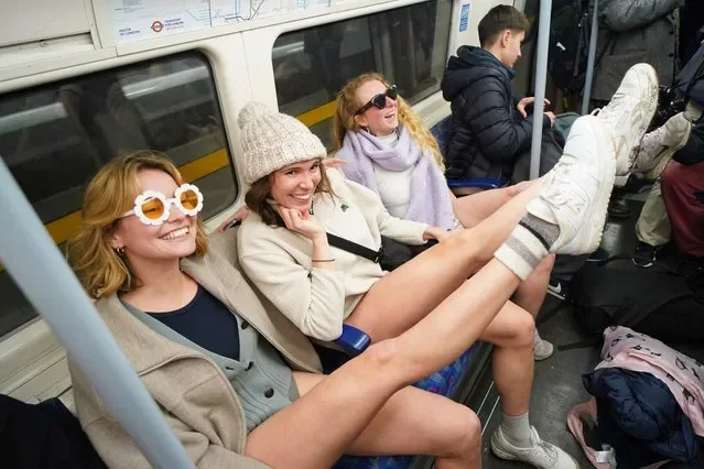 Commuters without trousers on London Underground during No Trousers Tube Ride January 2025