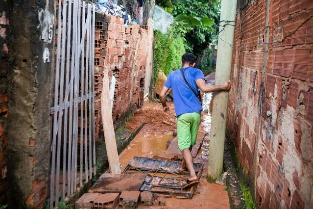 Man walks mud-covered street after deadly landslide in Ipatinga Minas Gerais Brazil January 2025