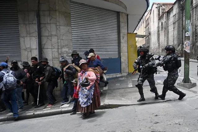Protesters flee riot police during food shortage demonstrations in La Paz Bolivia January 2025