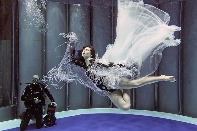 Woman free diving in tank at boot water sports boat show Duesseldorf Germany