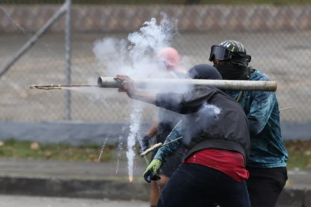 Demonstrators clashing with riot police during national strike in Panama City March 2025