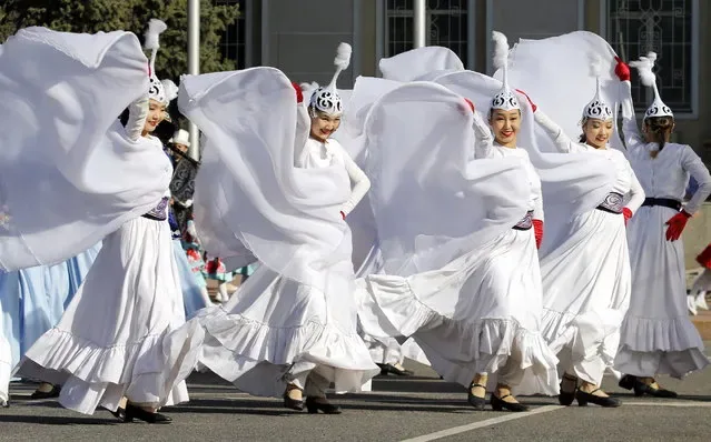 Kyrgyz artists in national costumes performing during Nowruz celebrations in Bishkek 2025