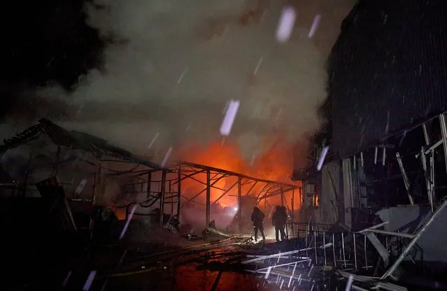 Emergency services respond to Russian drone strike on Kharkiv factory February 2025