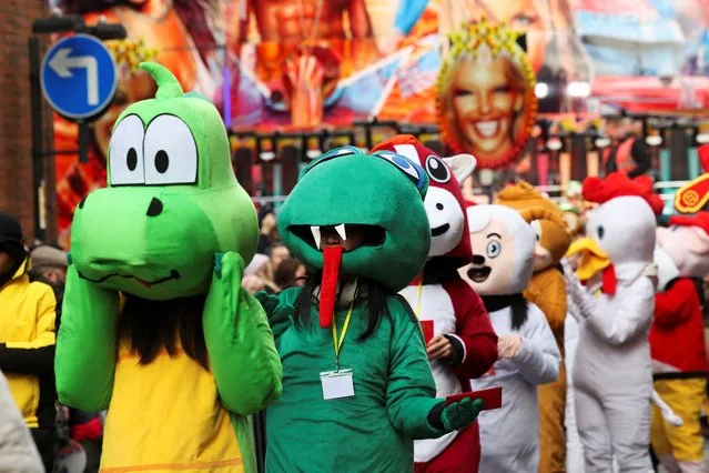 People in colorful costumes celebrating Lunar New Year in Manchester Britain February 2025