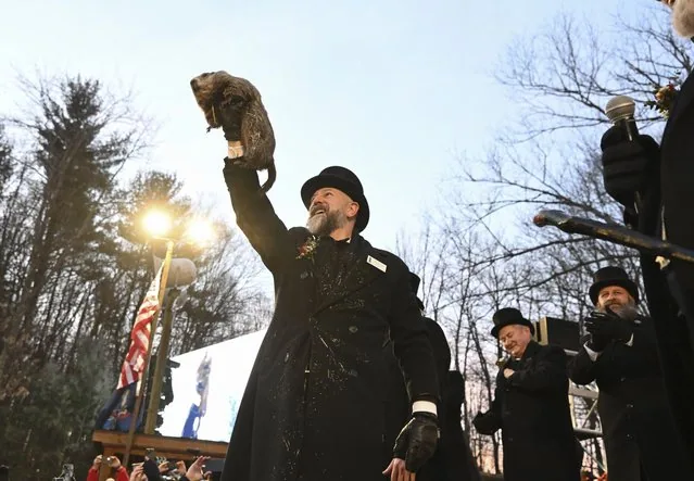 Handler A.J. Dereume holds Punxsutawney Phil during 139th Groundhog Day celebration 2025