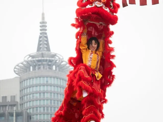 Lion dancer performing for crowd at Beijing temple during Chinese New Year Spring Festival 2025