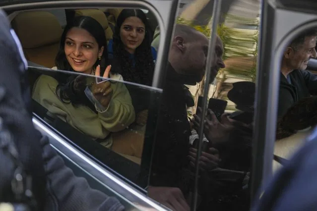 Released hostage Daniella Gilboa flashes victory sign returning home Petah Tikva Israel