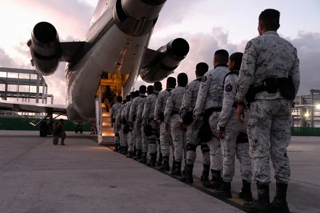 Mexico National Guard members queue at Cancun airport for northern border deployment