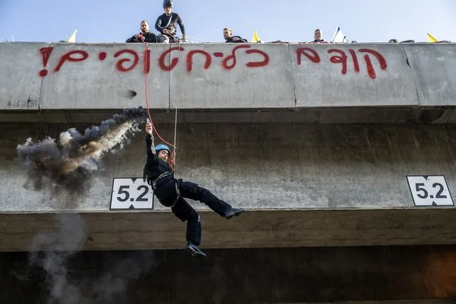 Protester jumping from bridge during hostage swap demonstration in Tel Aviv Israel