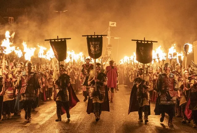 Jarl Squad torch procession through Lerwick during Up Helly Aa festival Shetland Isles
