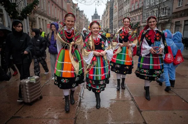 Girls in folk costumes at 33rd Great Orchestra of Christmas Charity finale Gdansk Poland