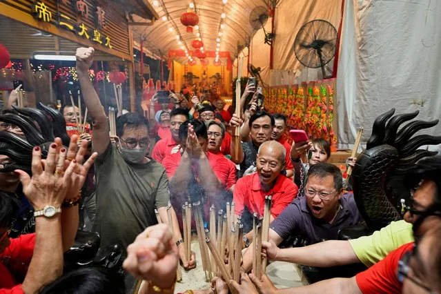 Devotees planting first joss stick at midnight at Leong Nam temple Singapore 2025