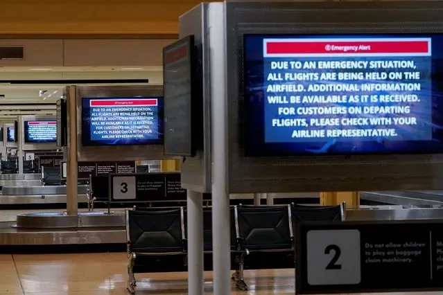 Emergency notices displayed at Ronald Reagan National Airport baggage claim after crash