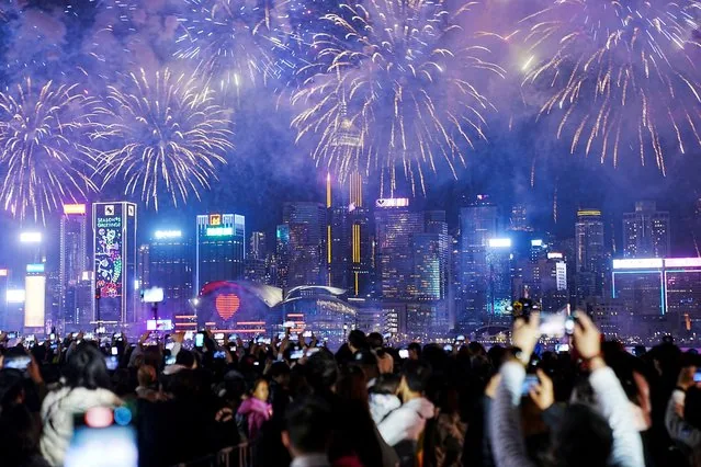 Fireworks exploding over Victoria Harbour Hong Kong on second Lunar New Year day