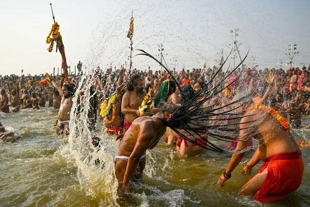 Naga Sadhus bathing at Sangam during Maha Kumbh Mela in Prayagraj January 2025