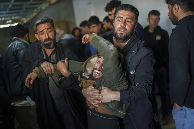 A man mourns at the funeral of Syrian Democratic Forces fighters in Hassakeh province